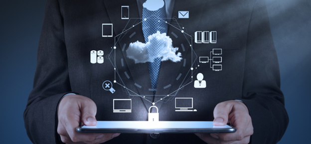 Businessman with a tablet showing cloud computing icons, illustrating technology integration in the modern business world.