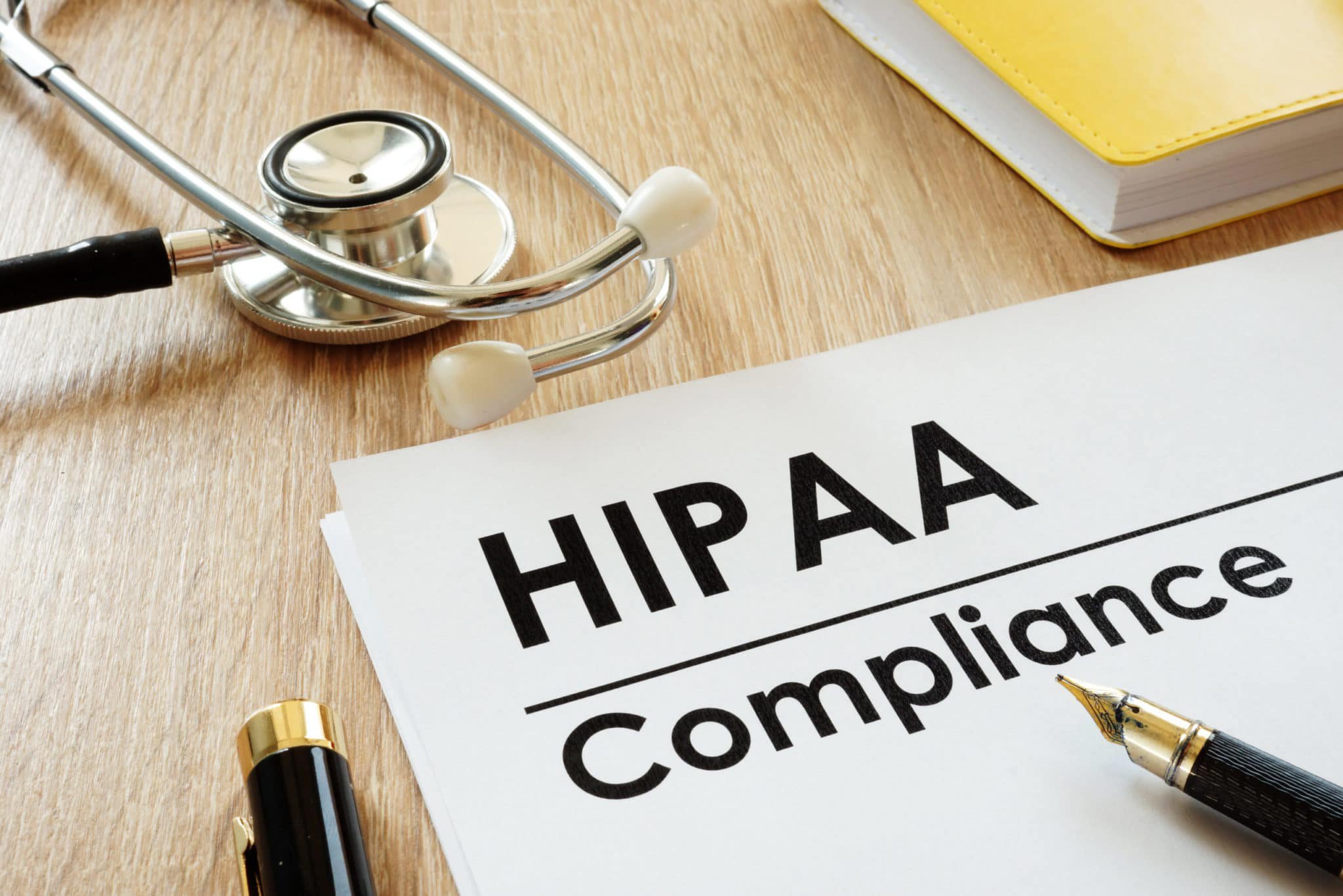 Image depicting HIPAA compliance with a medical stethoscope, illustrating its importance in healthcare privacy and security